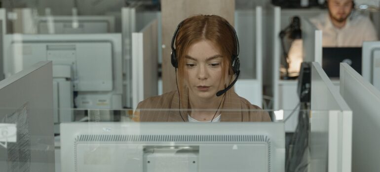 A person working as customer support on a computer.