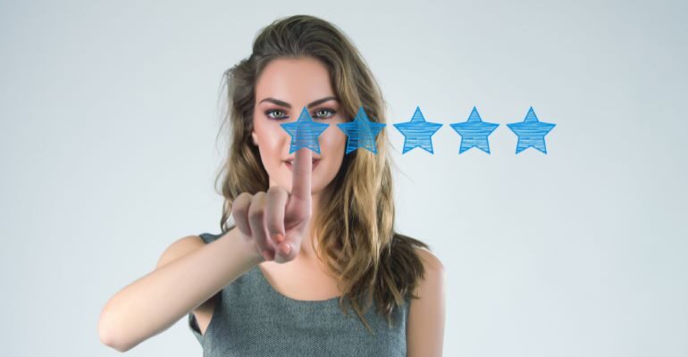 Woman with five-star rating in front of her.