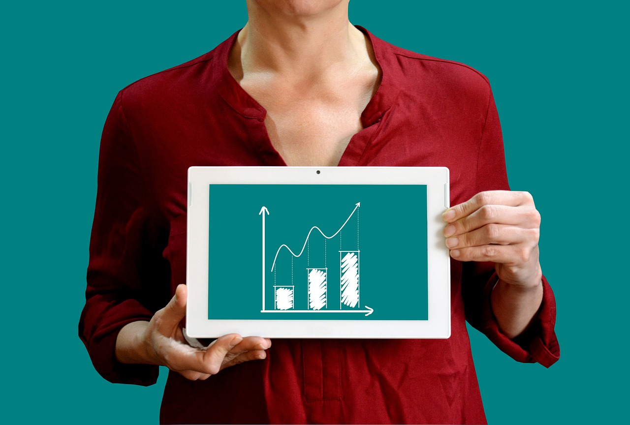 Woman holding a graph chart.