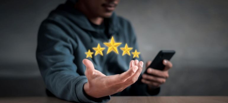 An illustration of a person giving a five star rating.