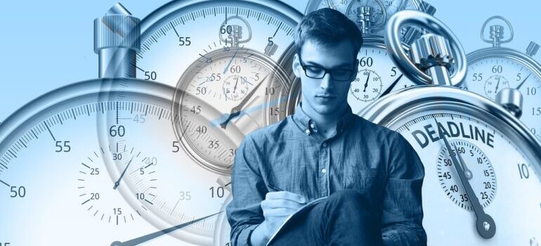 A person looking at performance review with a stopwatch in the background.
