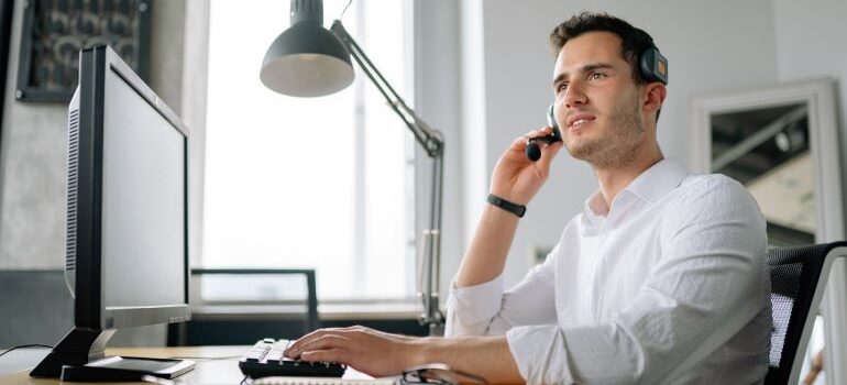 Person with headset, talking with a customer.