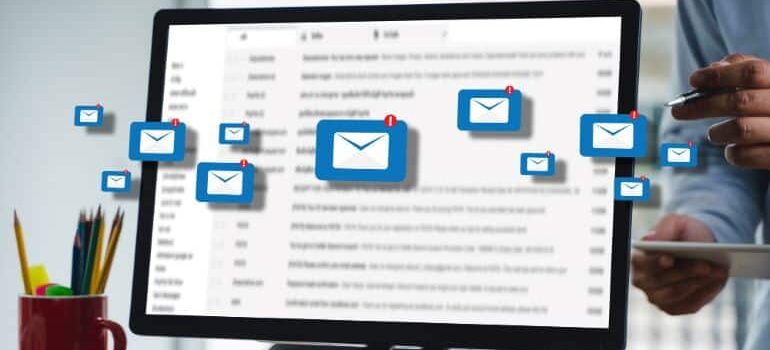 Emails floating in front of inbox screen.