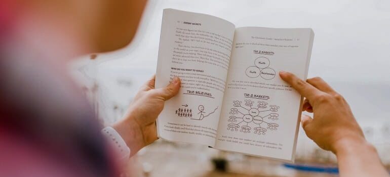A person reading up on marketing and learning how CRM boosts PPC campaigns.