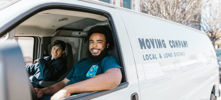 Two people in a moving van